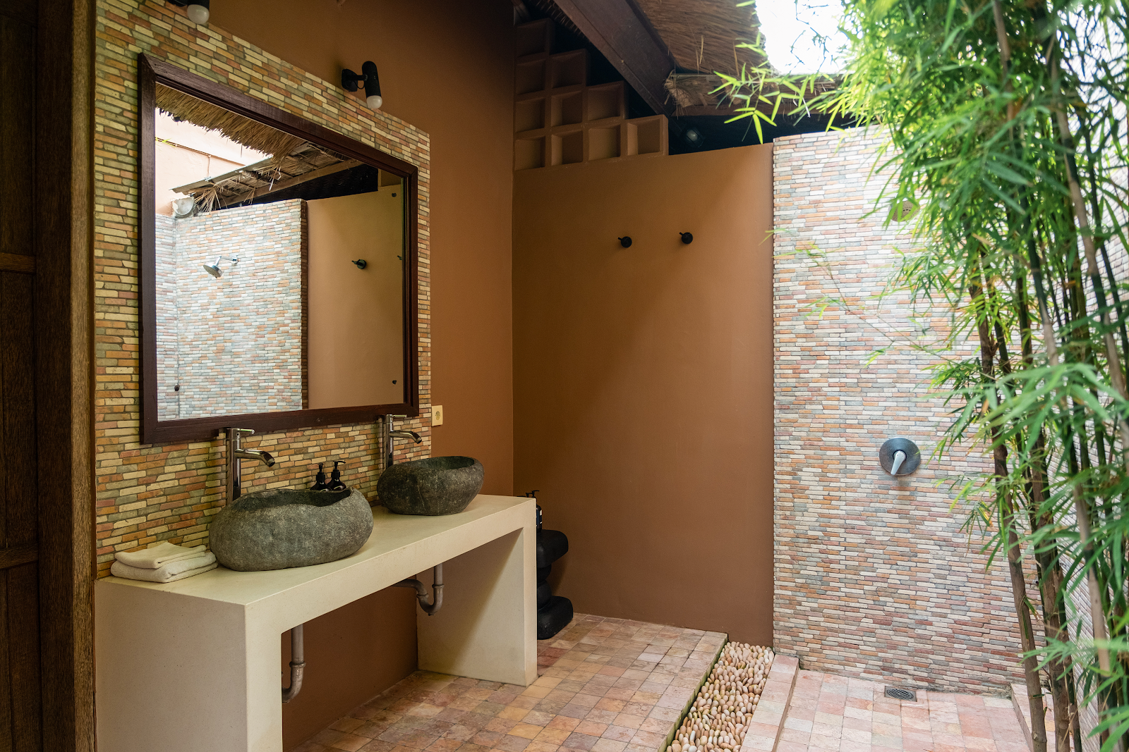 East Garden Chamber Suite with natural light and tropical palm views